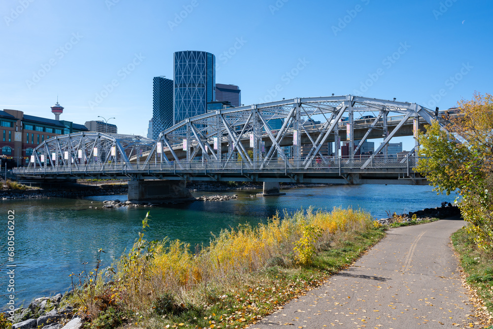 Calgary, Alberta, Canada - October 8 2023 : Reconciliation Bridge ( Langevin Bridge ) and Bow River Pathway. Downtown Calgary.
