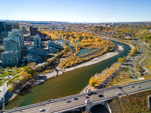 Prince's Island Park autumn foliage scenery. Aerial view of Downtown City of Calgary Centre St Bridge. Alberta, Canada. 