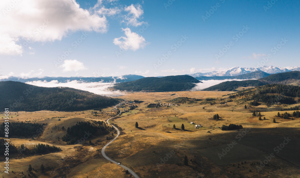 Fototapeta premium Aerial view of misty mountain in the morning