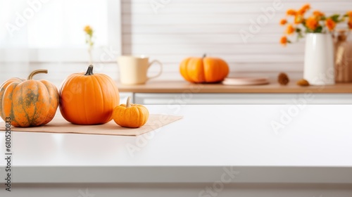 Pumpkins on table in modern kitchen, space for text. Halloween celebration