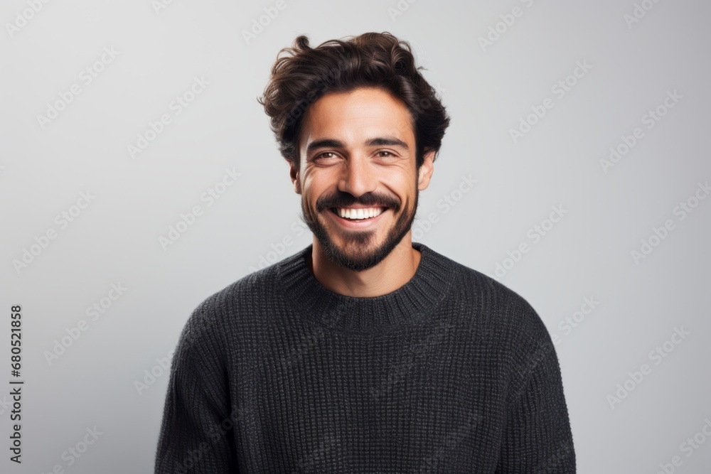 Portrait of a smiling man in his 30s dressed in a warm wool sweater against a white background. AI Generation Portrait of a smiling man in his 30s dressed in a warm wool sweater against a white background. AI Generation