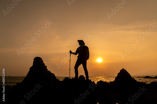 Tourists with backpacks hike on rocky of top mountain trekking is adventure activity sport for Traveller who love hike on summer holidays trekking and activity