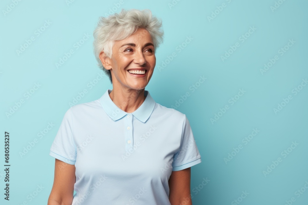 Portrait of a grinning woman in her 80s wearing a sporty polo shirt against a pastel blue background. AI Generation Portrait of a grinning woman in her 80s wearing a sporty polo shirt against a pastel blue background. AI Generation