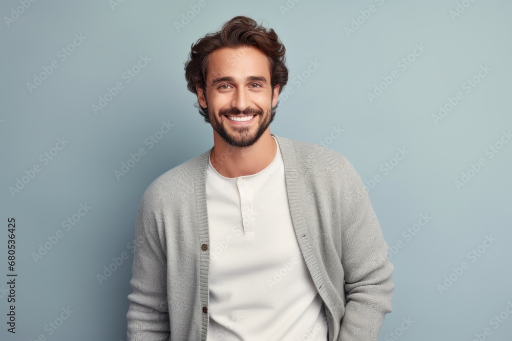 Portrait of a satisfied man in his 30s wearing a chic cardigan against a pastel gray background. AI Generation Portrait of a satisfied man in his 30s wearing a chic cardigan against a pastel gray background. AI Generation