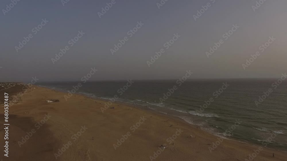Aerial view of the coast in advance flight, view of the town, bathers and sea Aerial view of the coast in advance flight, view of the town, bathers and sea