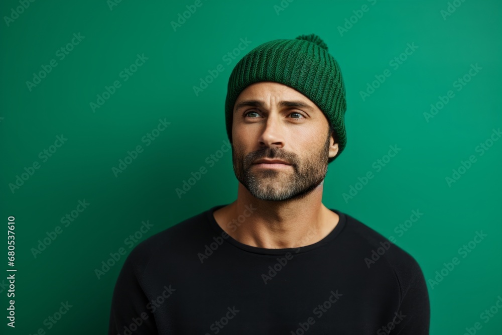 Portrait of a tender man in his 30s sporting a trendy beanie against a soft green background. AI Generation Portrait of a tender man in his 30s sporting a trendy beanie against a soft green background. AI Generation