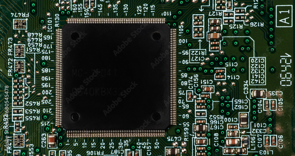Small microprocessor, microcontroller chip on a generic modern desktop PC computer motherboard Small microprocessor, microcontroller chip on a generic modern desktop PC computer motherboard