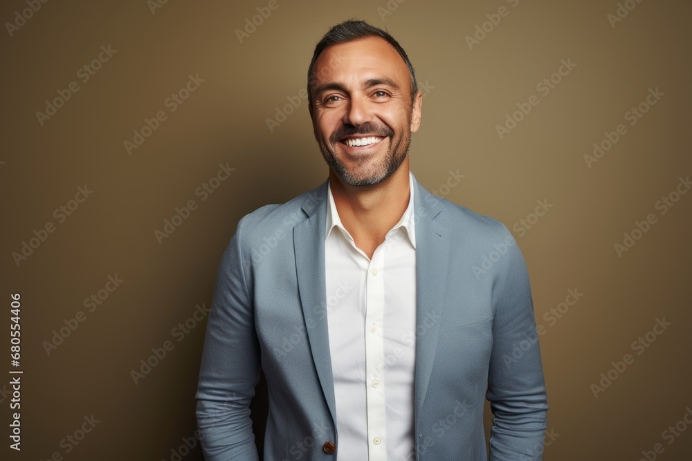 Portrait of a cheerful man in his 40s wearing a chic cardigan against a minimalist or empty room background. AI Generation Portrait of a cheerful man in his 40s wearing a chic cardigan against a minimalist or empty room background. AI Generation