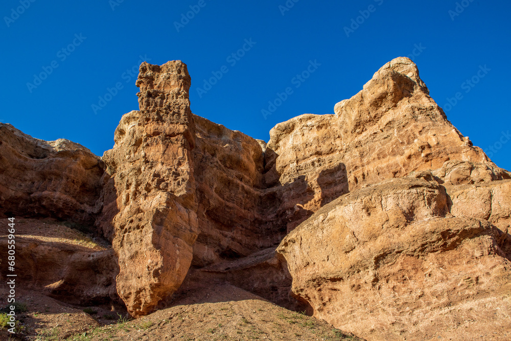 Fototapeta premium Charyn Canyon is a canyon on the Sharyn River in Kazakhstan east of Almaty. Landscape on a clear sunny day in summer