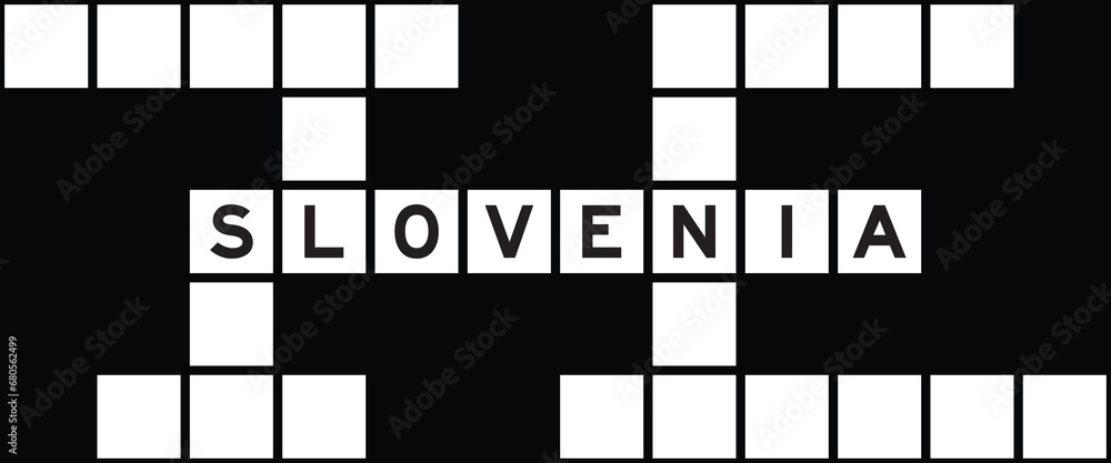 Alphabet letter in word slovenia on crossword puzzle background Stock