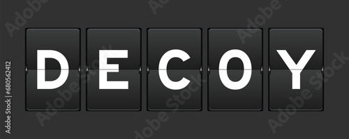 Black color analog flip board with word decoy on gray background