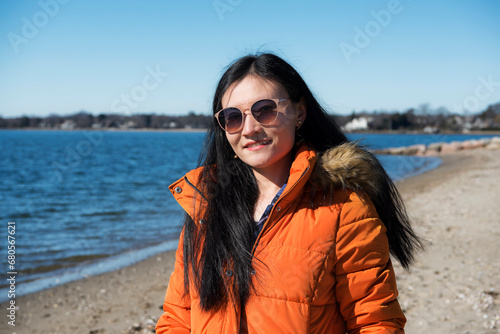 chinese woman on sasco beach fairfield connecticut sunny day photo