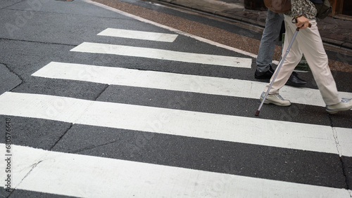 Zebra crossing line on the asphalt road, area for pedestrian crossing road safely. Transportation background photo.
