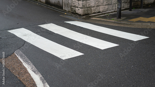 Wallpaper Mural Zebra crossing line on the asphalt road, area for pedestrian crossing road safely. Transportation background photo. Torontodigital.ca