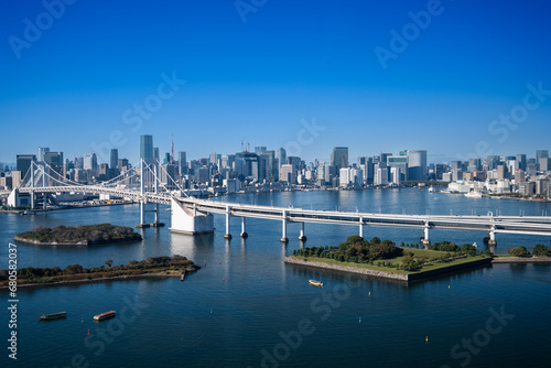 View of Tokyo Skyline and Tokyo Bay with Rainbow Bridge on  a clear blue sky day
