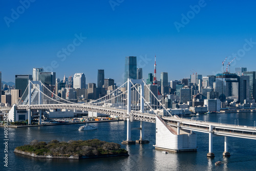View of Tokyo Skyline and Tokyo Bay with Rainbow Bridge on a clear blue sky day