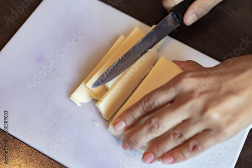 Slicing cheese close up