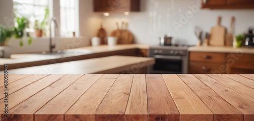 Wooden table on blurred kitchen bench background. Empty wooden table and blurred kitchen background for display or montage your products