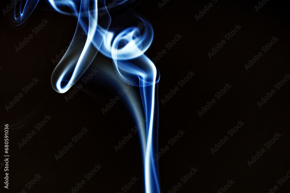 Close-up of ascending white blue smoke of burning incense stick against black background. Photo taken November 19th, 2023, Zurich, Switzerland. Close-up of ascending white blue smoke of burning incense stick against black background. Photo taken November 19th, 2023, Zurich, Switzerland.