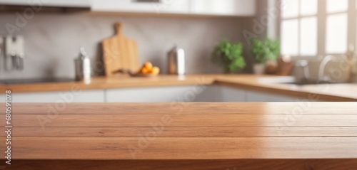 Wooden table on blurred kitchen bench background. Empty wooden table and blurred kitchen background for display or montage your products © German