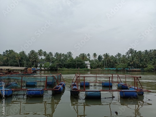 A canoe is a lightweight narrow water vessel, typically pointed at both ends and open on top, propelled by one or more seated or kneeling paddlers facing the direction of travel and using paddles photo