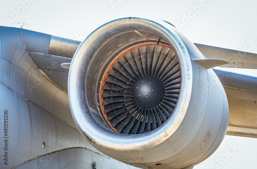 Close up detail with a large jet engine.