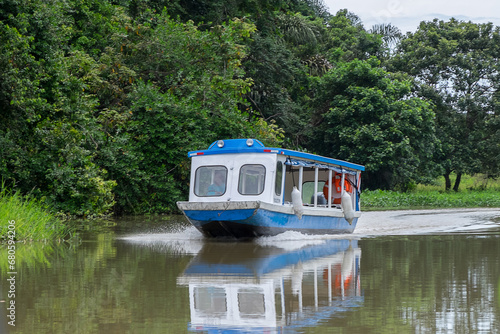 Transporte fluvial navegando por el canal de Tortuguero en la provincia de Limón, Costa Rica photo