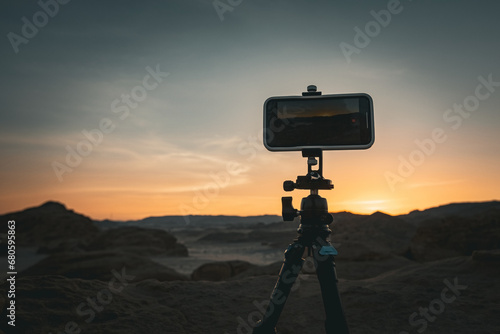 Smartphone on tripod in the desert shooting sunset Egypt photo