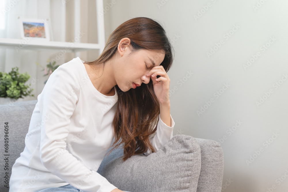 Brain stroke or low blood pressure symptom on people medical concept. Young beautiful woman has a dizziness and motion blurry during standing off sofa at home