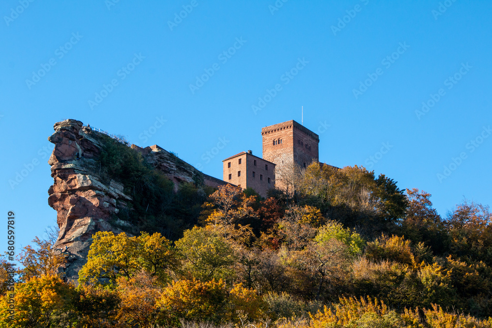 Trifels Castle in Germany's Palatinate Forest, surrounded by colorful trees in autumn