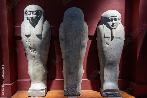 CAIRO, EGYPT - 02 SEP 02, 2023: three stone sarcophagi with a face in the Cairo Museum