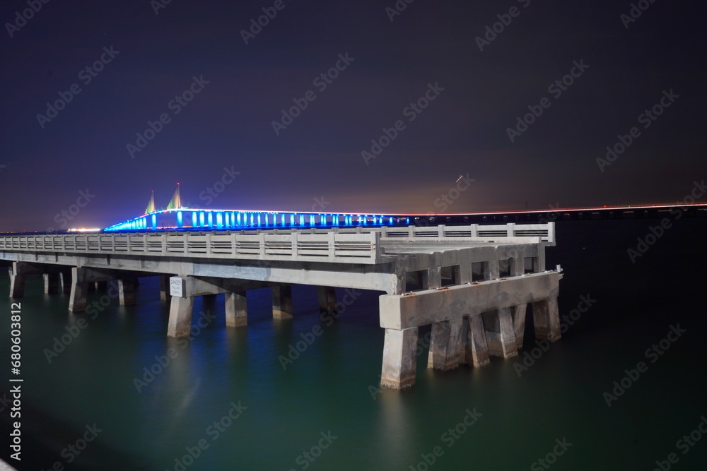 Obraz premium Night landscape of Skyway Fishing Pier State Park is a Florida State Park. The old broken collapsed bridge were left in place and converted into the longest fishing pier in the world.