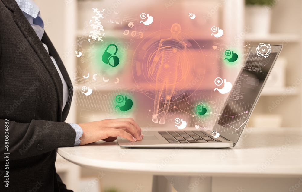 Doctor working on laptop with healthcare concept Doctor working on laptop with healthcare concept
