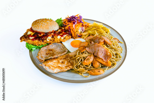 A delicious variety of steak, spaghetti with trimmings, fried eggs, french fries, salad with mayonnaise on plate with white background. Steak set with pasta. Various and delicious steak meal set.