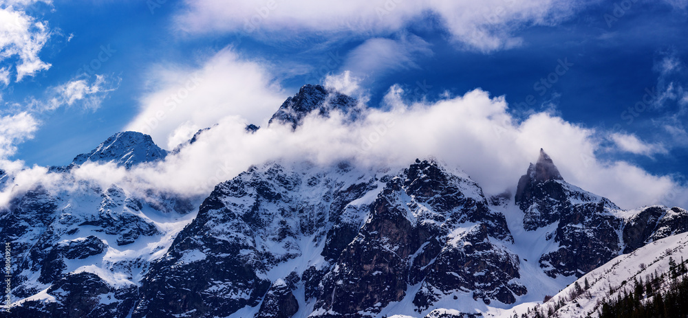 Obraz premium Mountain peaks near Morskie Oko or Sea Eye Lake in Poland at Winter. Tatras range