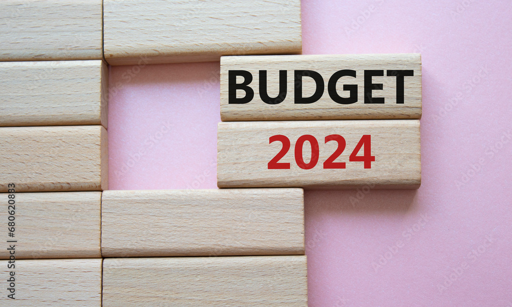 Budget 2024 symbol. Wooden blocks with words Budget 2024. Beautiful pink background. Business and Budget 2024 concept. Copy space. Budget 2024 symbol. Wooden blocks with words Budget 2024. Beautiful pink background. Business and Budget 2024 concept. Copy space.