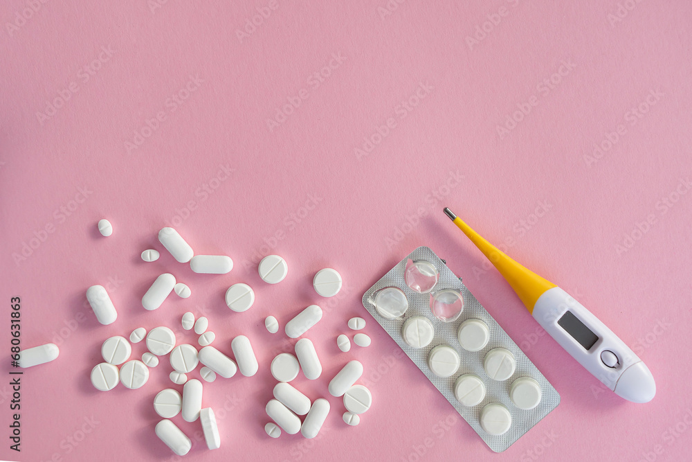 medicine tablets antibiotic pills on a pink background, cold and disease treatment medicine tablets antibiotic pills on a pink background, cold and disease treatment
