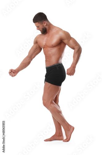 Young bodybuilder with muscular body on white background