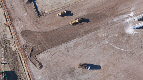 Earthmoving equipment. Aerial view of a large construction site with several earthmoving machines. © petro