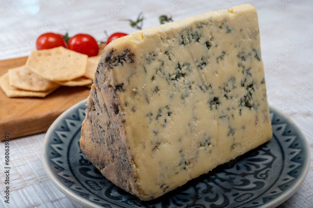 Cheese collection, English semi-soft, crumbly old stilton blue cheese close up Cheese collection, English semi-soft, crumbly old stilton blue cheese close up