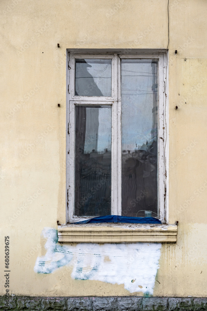 Old wooden double sash window. Painted white.
