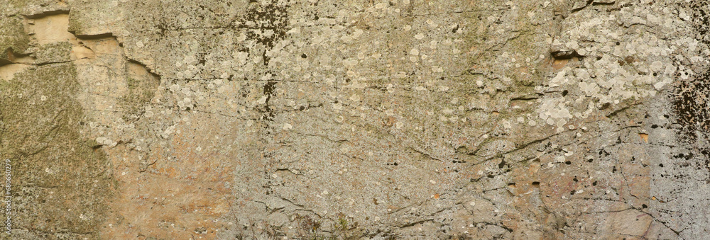 Closeup of the rough stone texture of a big rock surface for natural background concepts. Closeup dirty natural stone background texture in warm tones Closeup of the rough stone texture of a big rock surface for natural background concepts. Closeup dirty natural stone background texture in warm tones