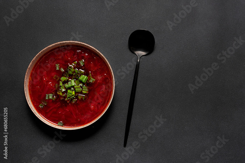 Traditional Ukrainian dish borsch on black stone table top view, copy space for your design. photo