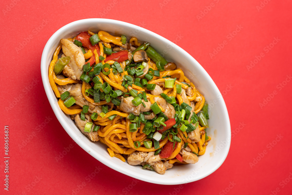 Asian cuisine. Noodles with chicken. Close up