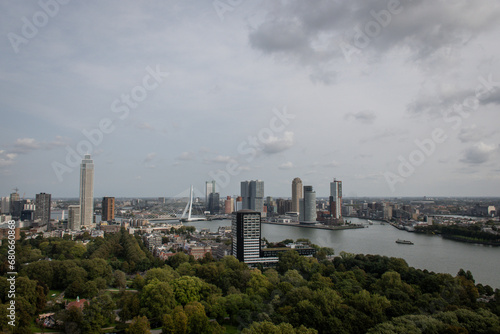 Cosmopolitan famous Dutch city Rotterdam with skyscraper buildings and river Nieuwe Maas. Aerial daytime view of skyline in Holland © drew