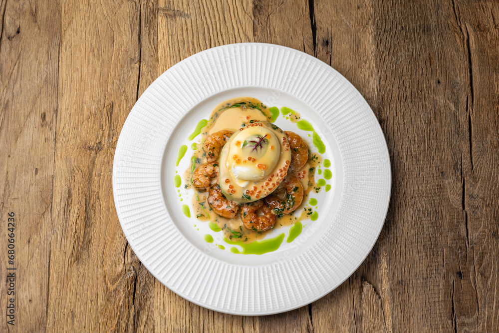 poached egg with avocado, tiger prawns and red caviar poached egg with avocado, tiger prawns and red caviar