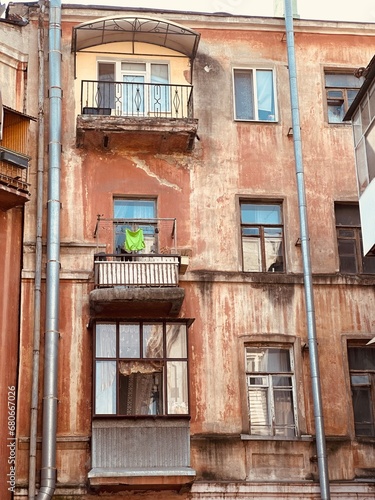 facade of an old house, laundry drying on the balcony