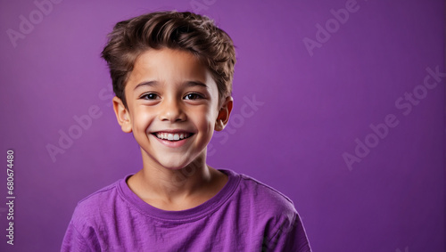 Boy smile isolated in bright purple background, backdrop with copy space