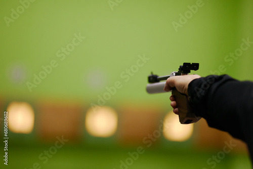 aiming at a target with an air pistol photo