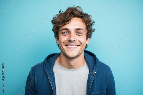 young man with white t-shirt on blue background